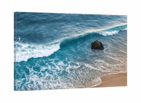 A wave breaking on a beach in central California.