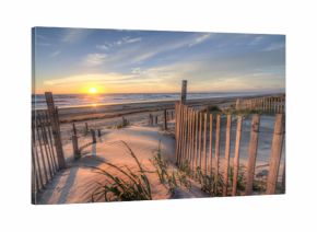Sunrise as seen from the sand dunes at the Outer Banks, NC around Corolla Beach in September, 2014.