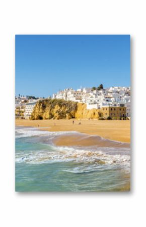 Wide, sandy beach in white city of Albufeira, Algarve, Portugal