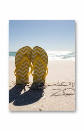 Beach holiday with 2020 in the sand