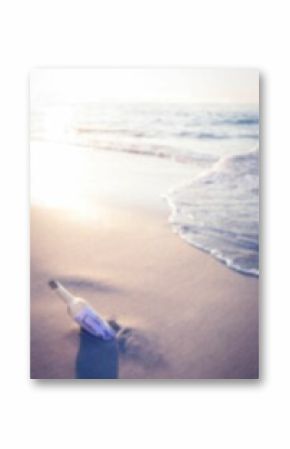 Message in a bottle at sunny sea shore
