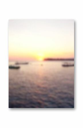 Defocused image of boats moored on sea