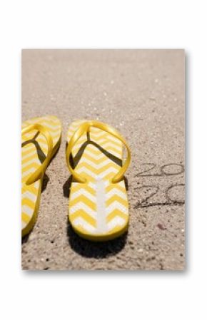 Beach holiday with 2020 in the sand
