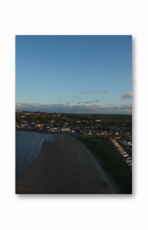 Beach against blue sky at town