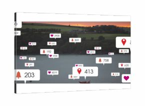 Floating notification bubbles drifting above sunset lake with red canoe and distant farmhouse