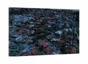 Showing high-altitude coastal neighborhood, displaying detached houses, parked cars, code overlay