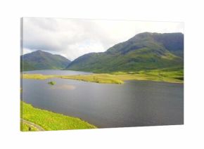 Dominating upland valley, large freshwater lake holding grassy islet, curving shoreline and path