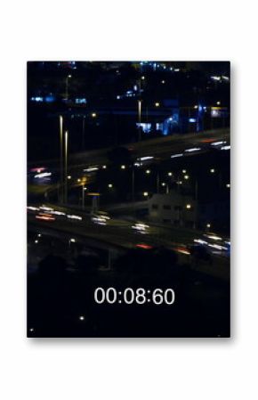 Digital camera records fast-moving night traffic and cityscape in 4k.