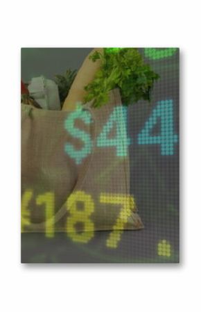 Image of numbers with dollar signs over shopping bag with fresh vegetables