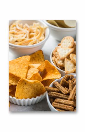 Salty beer snacks in whit bowls