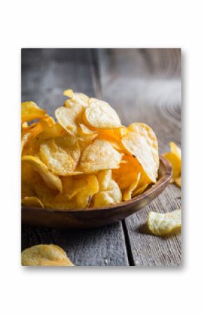 Potato chips on a wooden table