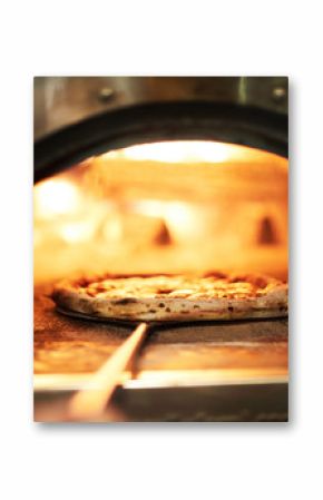 Special tray with handle with raw pizza inside oven for roasting on fire
