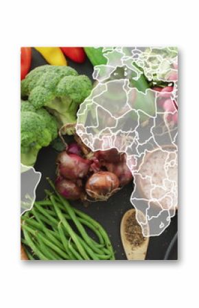 Image of world map over table of vegetable