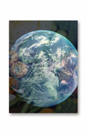 Image of spinning globe over table of vegetable