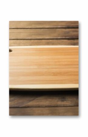 Close-up of wooden chopping board on hardwood floor