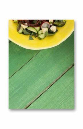 Cropped image of food in bowls on green table