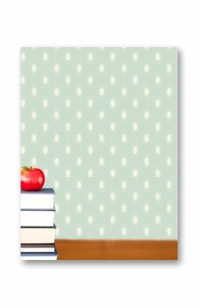 Red apple on pile of books