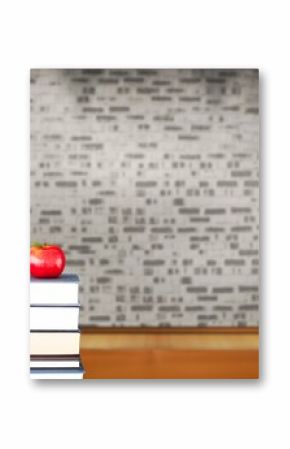 Red apple on pile of books