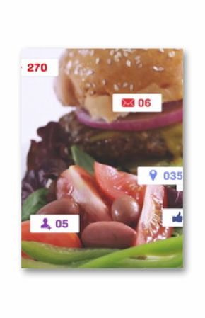 Displaying sesame bun burger melting cheese with fries and fresh salad on white table, social icons