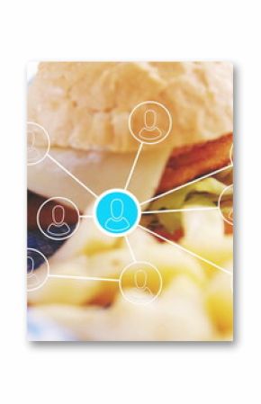 Showing burger sandwich resting on checkered liner in cafe, with cheese, fries and network graphic