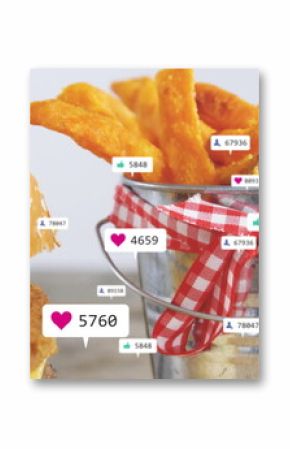 Displaying bucket with sweet potato fries beside chicken sandwich on table with icons, copy space