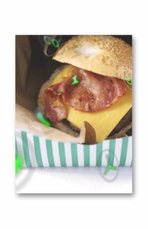 Nestling bacon cheeseburger in green-white container on white table, with floating digital icons