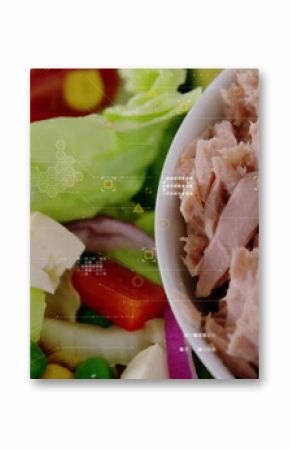 Displaying white bowl holding tuna flakes on kitchen counter, with lettuce onion cheese, copy space