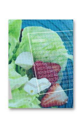 Displaying bowl of salad with lettuce strawberries cheese on blue table, with digital grid overlay
