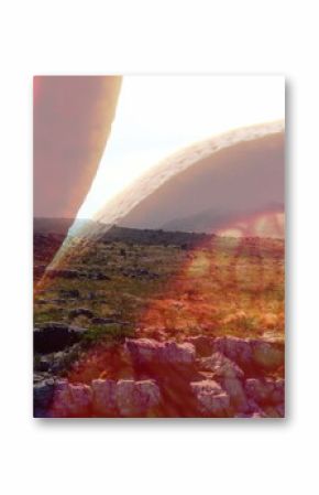 Floating large grapefruit slice hovering over grassy rocky plateau, showing double exposure effect