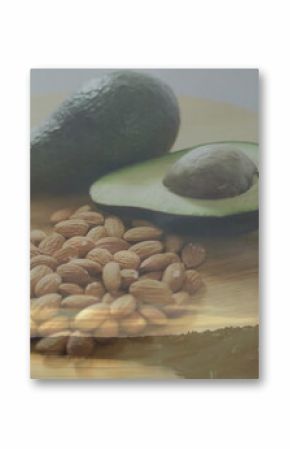 Displaying cutting board with whole avocado, halved avocado, seed, almonds in studio river sunset