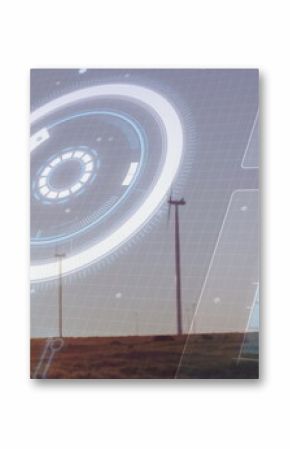 Displaying circular HUD overlay across rural grassland at dusk, with wind turbines and bar graph