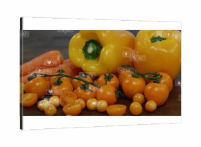 Displaying bell peppers, carrots, cherry tomato vine on dark wooden tabletop with digital icons