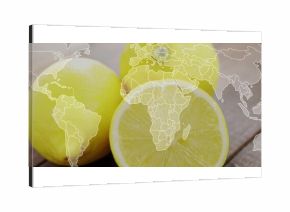 Featuring three bright yellow lemons sitting on wooden tabletop, with faint white world map overlay