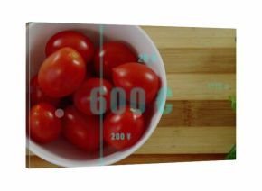 Displaying white ceramic bowl with tomatoes, lettuce on cutting board showing readouts, copy space