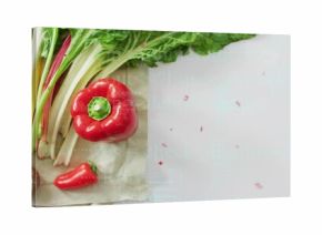 Displaying greens, mushrooms, bell and chili peppers lying on kitchen cloth, copy space