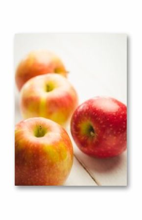 Fresh red apples on table