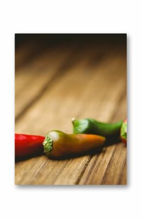 Close-up of chillies on wooden floor
