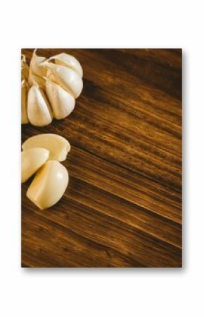 Garlic cloves and bulb on hardwood floor
