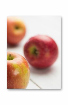 Fresh red apples on wooden table