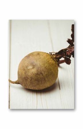 Raw beetroot on wooden table