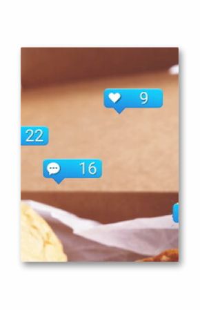 Displaying sandwich bun and fried chicken in takeout box, with notification icons