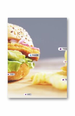 Showcasing sesame-seeded burger with crinkle cut fries on wooden board, overlay icons, copy space