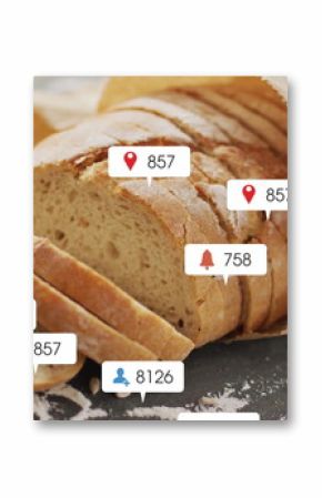 Sliced crusty loaf wrapped in brown paper resting on kitchen countertop, with floating social icons