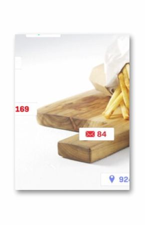 Beef burger, fries, mustard jar sitting on cutting board in studio, with social icons, copy space