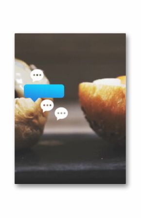 Displaying seeded burger bun halves beef patty melted cheese on dark slate, chat icons, copy space