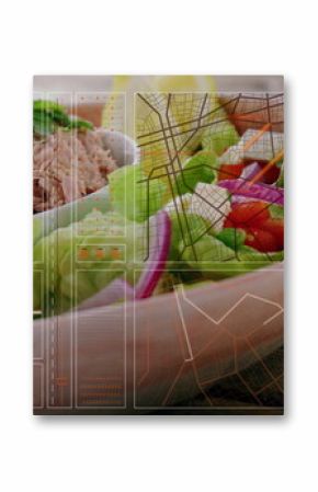 Showing bowl holding shredded tuna salad on table, with greens and tomato skewers, graphic overlay