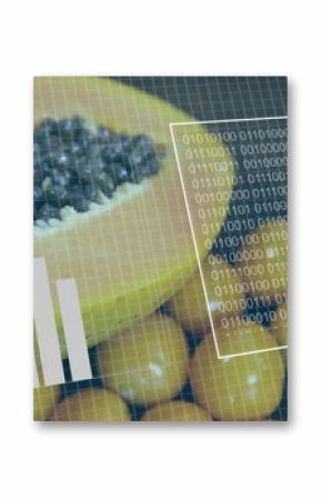Displaying papaya halves resting on kumquat bed at augmented reality setup, with data visualization