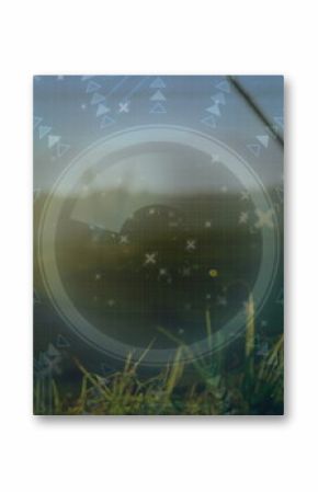 Emerging grass blades displaying HUD in greenhouse, with arrows, triangles, crosses and circuitry