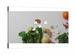 Showcasing fresh produce and nuts at kitchen counter, with Swiss chard, lime, roots, seeds, peppers