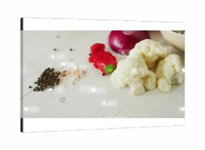 Showing cauliflower florets, pepper and onion slices, translucent social icons on table, copy space